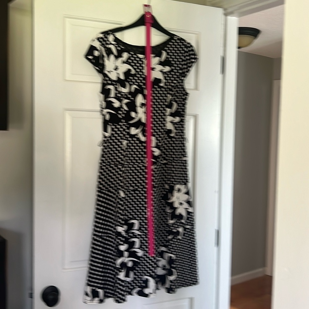Black and white dress with a pink belt